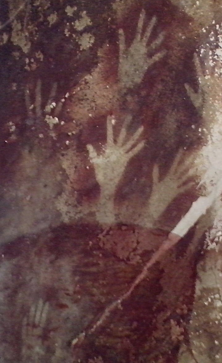 Ancient hand stencils on a cave wall in Sulawesi, Indonesia, dating back nearly 40,000 years