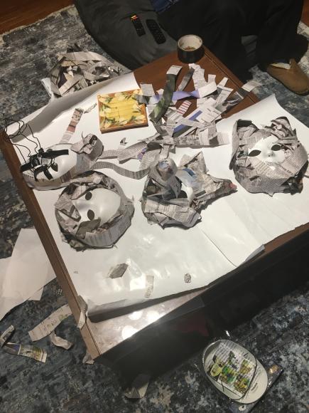 Papier-mâché animal masks being made with newspaper strips