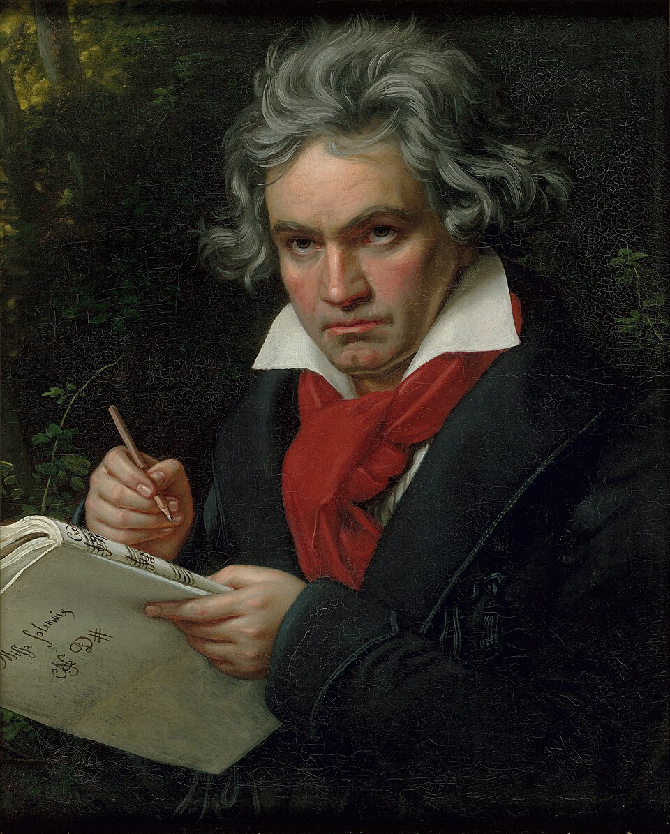 A painted portrait of Ludwig van Beethoven composing music with a pen and manuscript