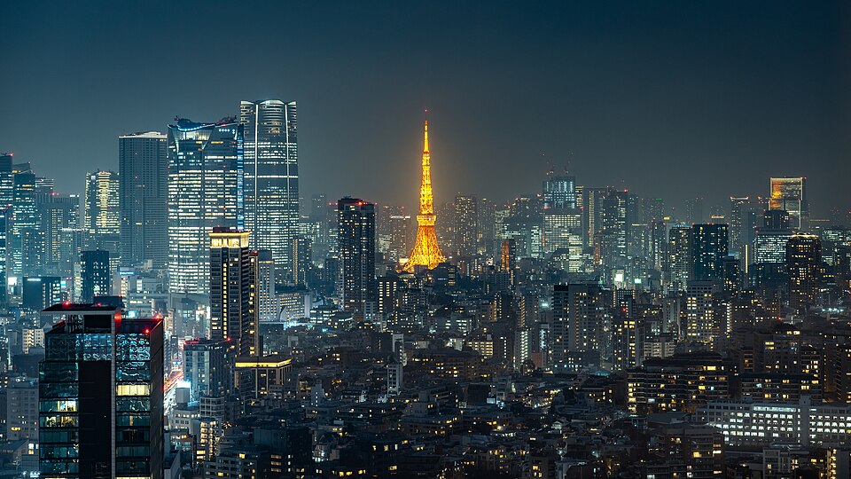 The Tokyo skyline at night with the orange-lit Tokyo Tower in the center