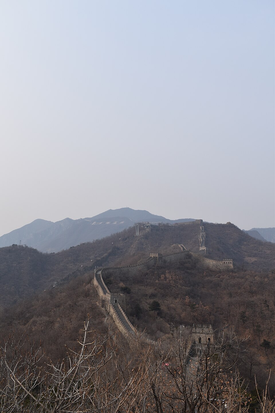 The Great Wall of China winding across mountains with watchtowers
