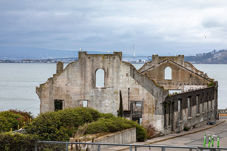 The ruins of the Officers’ Club on Alcatraz Island with the Bay Bridge in the background