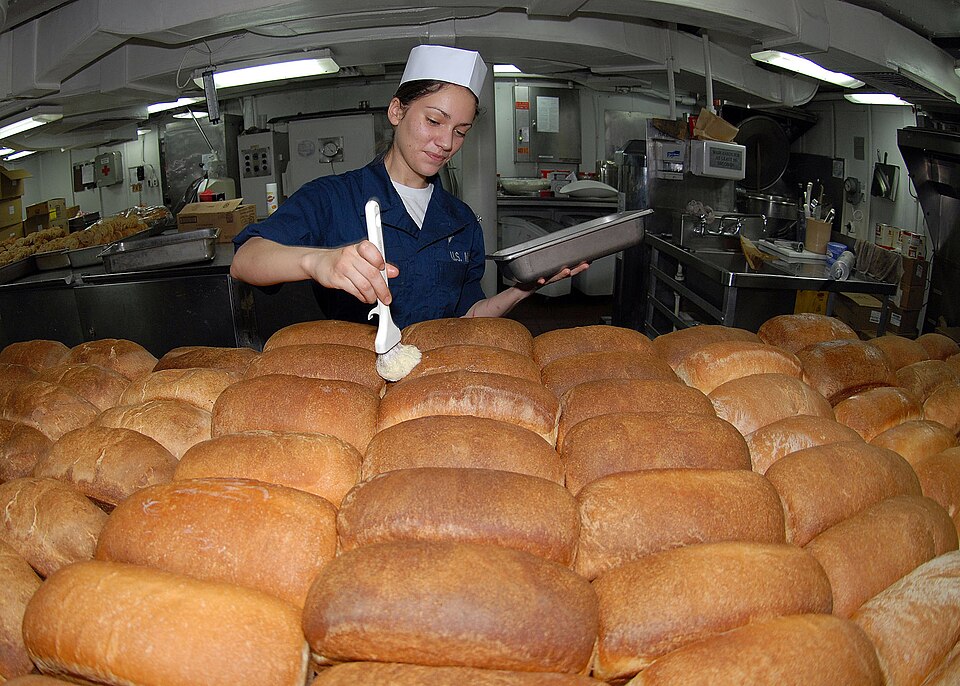 Rows of fresh-baked bread loaves made from wheat flour
