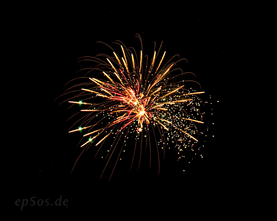 Colorful fireworks lighting up the night sky during a celebration