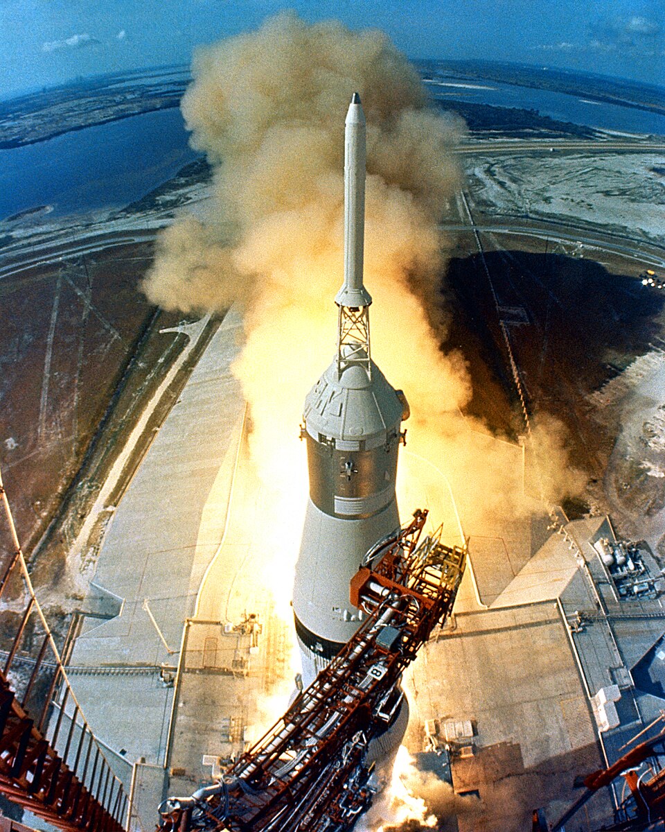 The Saturn V rocket launching into the sky during the Apollo 11 mission