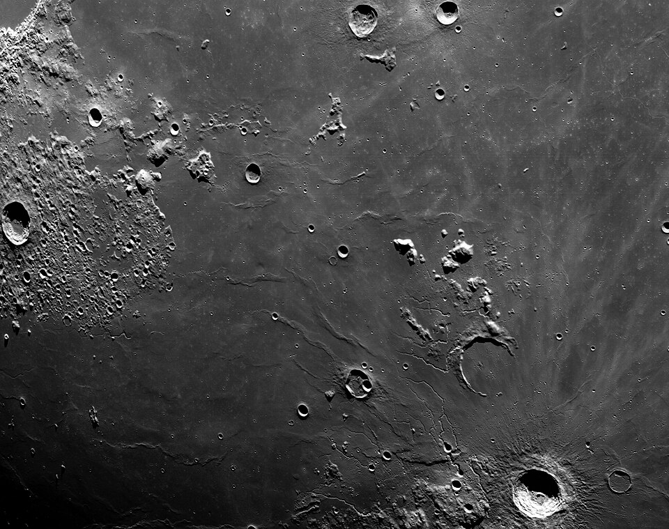 A close-up view of the Moon’s surface showing craters of many different sizes